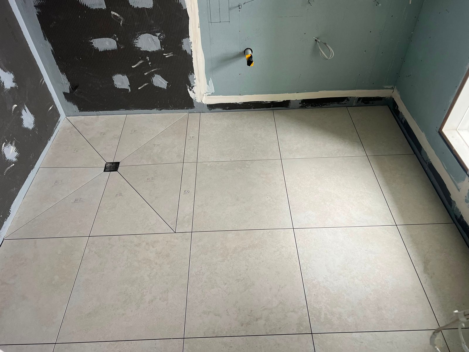 Residential floor tile installation by Bravo Tiling